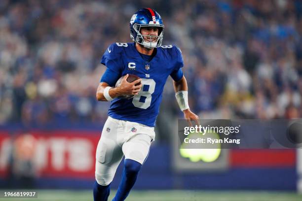 Daniel Jones of the New York Giants carries the ball as he scrambles during an NFL football game against the Dallas Cowboys at MetLife Stadium on...