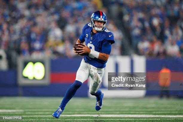 Daniel Jones of the New York Giants carries the ball as he scrambles during an NFL football game against the Dallas Cowboys at MetLife Stadium on...