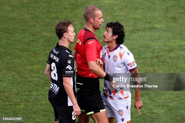 Referee Daniel Elder separates Jake Hollman of the Bulls and Stefan Colakovski of the Glory during the A-League Men round 14 match between Macarthur...