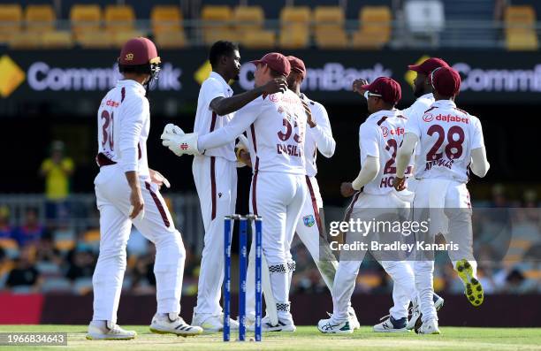 Alzarri Joseph of the West Indies celebrates with team mates after taking the wicket of Nathan Lyon of Australia during day four of the Second Test...