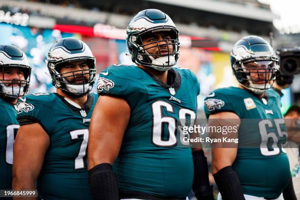 Jordan Mailata of the Philadelphia Eagles is seen in the team huddle during pregame warmups before an NFL football game against the Dallas Cowboys at...