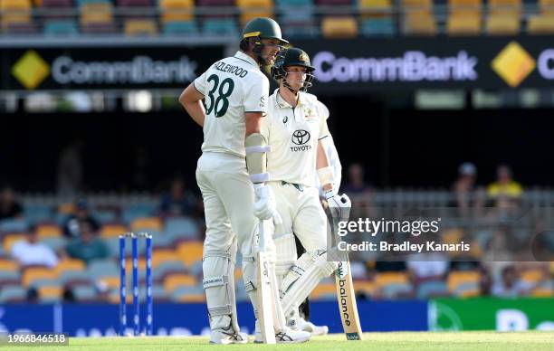 Steve Smith and Josh Hazlewood of Australia talk tactics during day four of the Second Test match in the series between Australia and West Indies at...