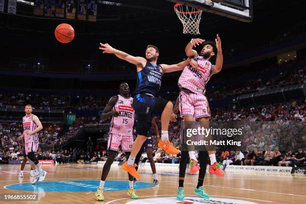 Matthew Dellavedova of United passes under pressure from Denzel Valentine of the Kings during the round 17 NBL match between Sydney Kings and...