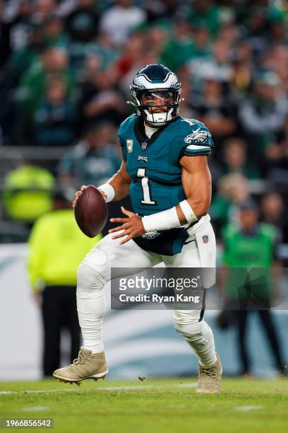 Jalen Hurts of the Philadelphia Eagles drops back and looks to throw a pass during an NFL football game against the Dallas Cowboys at Lincoln...