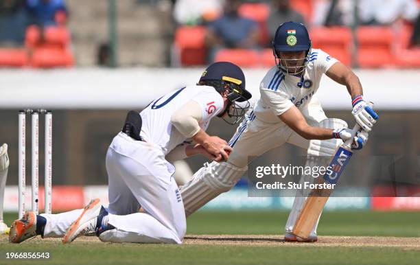 England fielder Ollie Pope takes the catch off the bowling of Tom Hartley to dismiss Shubman Gill during day four of the 1st Test Match between India...