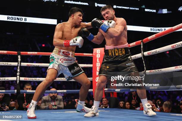 Jaime Munguia of Mexico lands a left on John Ryder of Great Britain during the WBC silver super middleweight title fight at Footprint Center on...