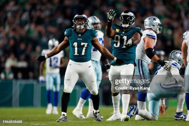 Jakobe Dean of the Philadelphia Eagles celebrates with Fletcher Cox of the Philadelphia Eagles after a sack during an NFL football game against the...