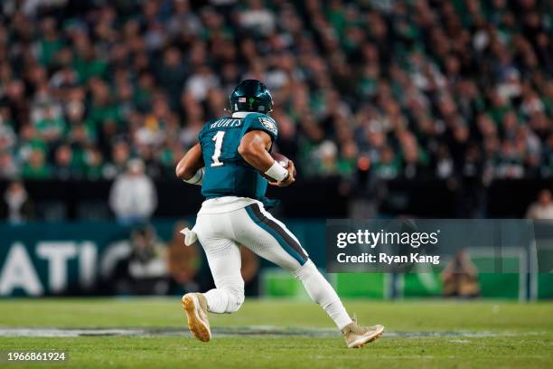 Jalen Hurts of the Philadelphia Eagles runs the ball as he scrambles from behind during an NFL football game against the Dallas Cowboys at Lincoln...