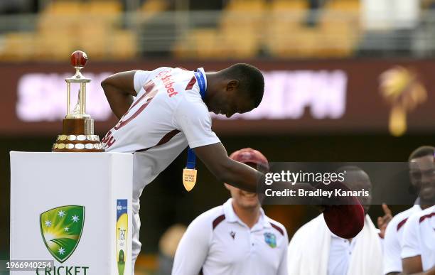 Shamar Joseph of the West Indies takes a bow as he celebrates winning the man of the match and man of the series awards during day four of the Second...