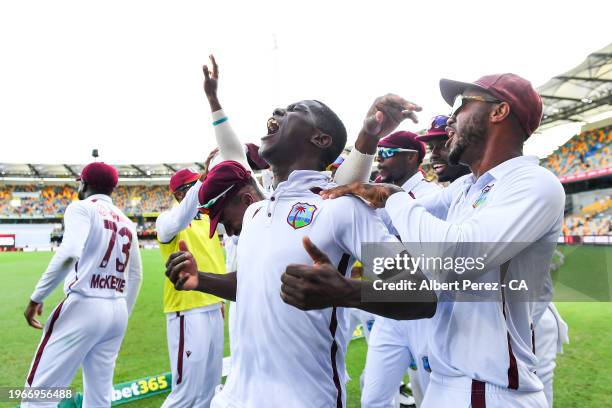 Shamar Joseph of West Indies celebrates with team mates after dismissing Josh Hazlewood of Australia and giving West Indies the victory during day...