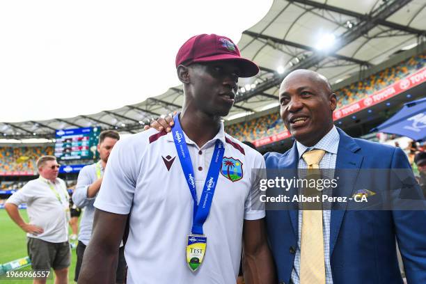 Shamar Joseph of West Indies is congratulated by Brian Lara during day four of the Second Test match in the series between Australia and West Indies...