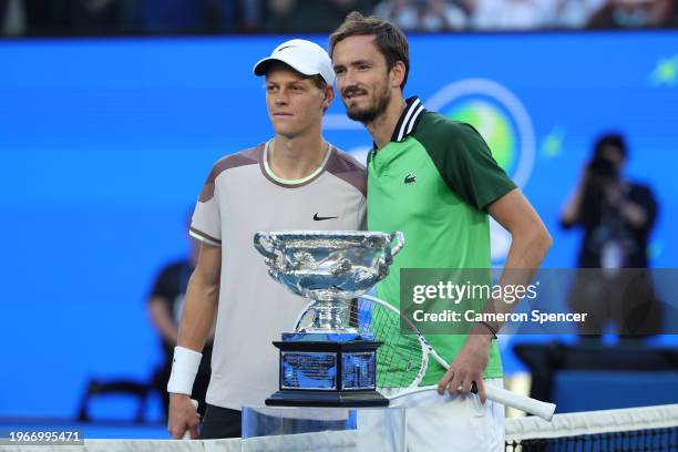 Jannik Sinner of Italy and Daniil Medvedev pose with the Norman Brookes Challenge Cup ahead of their Men's Singles Final match during the 2024...