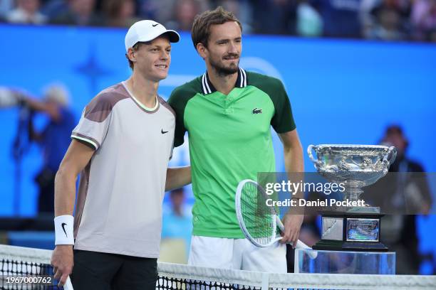 Jannik Sinner of Italy and Daniil Medvedev pose with the Norman Brookes Challenge Cup ahead of their Men's Singles Final match during the 2024...