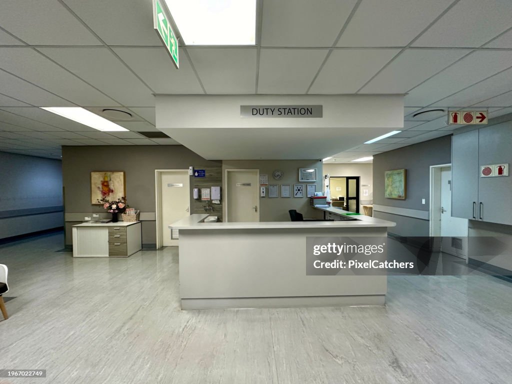 Wide shot empty hospital ward reception desk