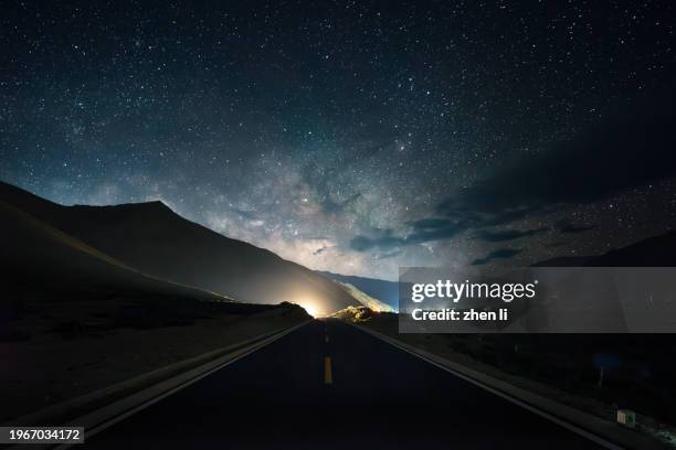 road under the milky way - car point of view stock pictures, royalty-free photos & images