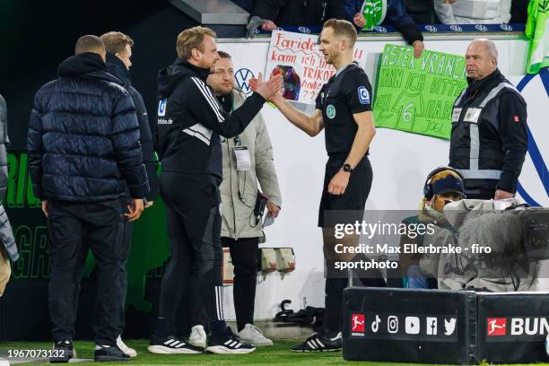 Referee Sören Storks with the new 4th official Tobias Krull of MTV Gifhorn after the Bundesliga match between VfL Wolfsburg and 1. FC Köln at...