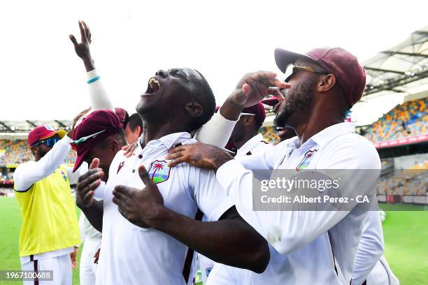 Shamar Joseph of West Indies celebrates with team mates after dismissing Josh Hazlewood of Australia and giving West Indies the victory during day...