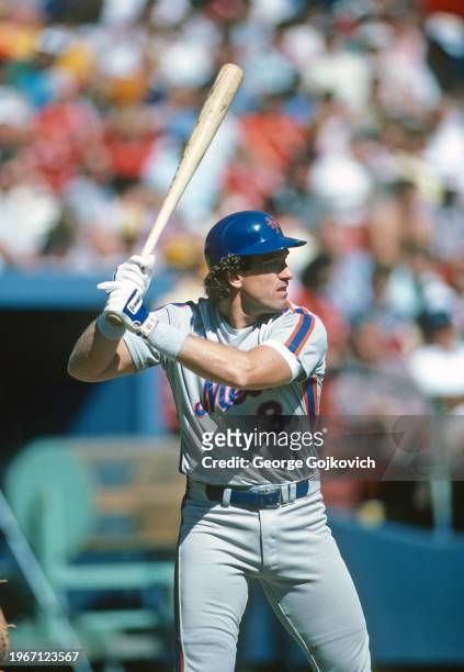 Gary Carter of the New York Mets bats against the Pittsburgh Pirates during a Major League Baseball game at Three Rivers Stadium in 1985 in...