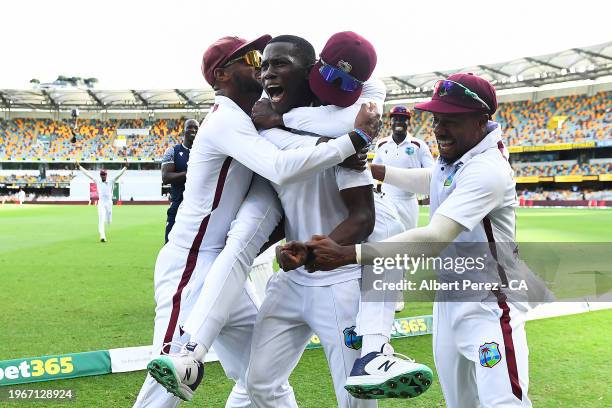 Shamar Joseph of West Indies celebrates with team mates after dismissing Josh Hazlewood of Australia and giving West Indies the victory during day...