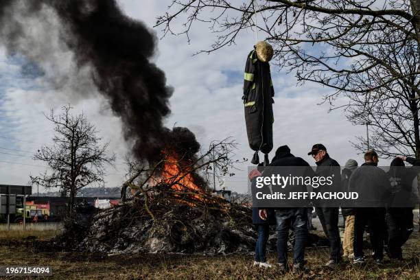 Farmers block the A6 motorway toll, on January 31, 2024 in Villefranche-sur-Saône, near Lyon, amid nationwide protests called by several farmers...