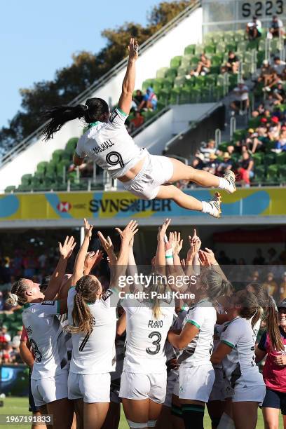 Lucy Mulhall of Ireland is thrown into the air by the team after winning the 2024 Perth SVNS women's Cup Final match between Ireland and Australia at...