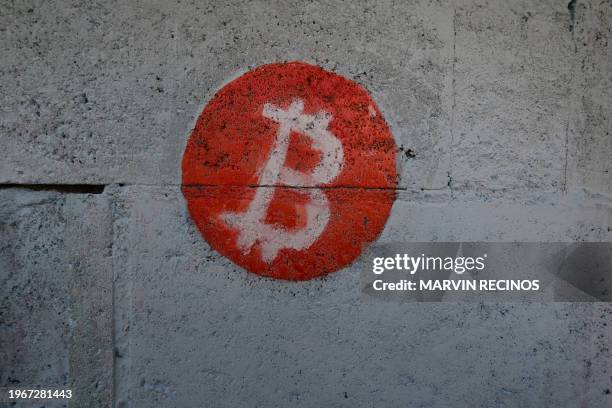 Bitcoin logo is seen on the wall of the room US bitcoiner Corbin Keegan built in the courtyard of a fishermen's house in Playa Blanca, in the...