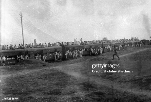 People migrating in large number fleeing in train during Junagadh unrest in Junagadh Region on 24th September 1947, Gujarat India.