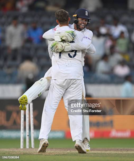 England wicketkeeper Ben Foakes celebrates with Tom Hartley after taking the final wicket during day four of the 1st Test Match between India and...