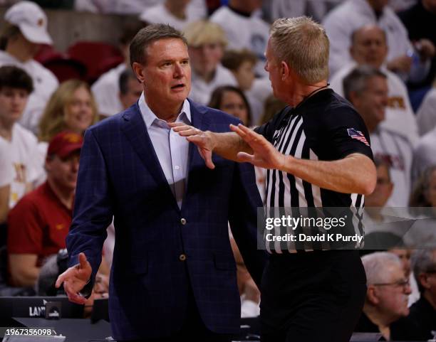 Head coach Bill Self of the Kansas Jayhawks debates a call with an official in the first half of play at Hilton Coliseum on January 27, 2024 in Ames,...