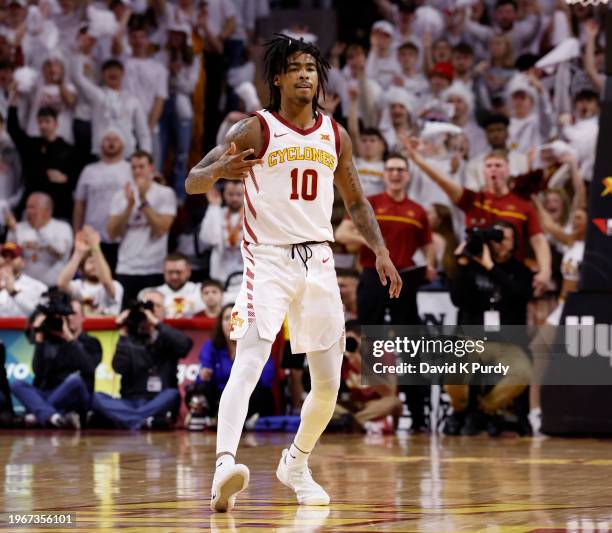 Keshon Gilbert of the Iowa State Cyclones signals three points after sinking a three point basket in the first half of play at Hilton Coliseum on...