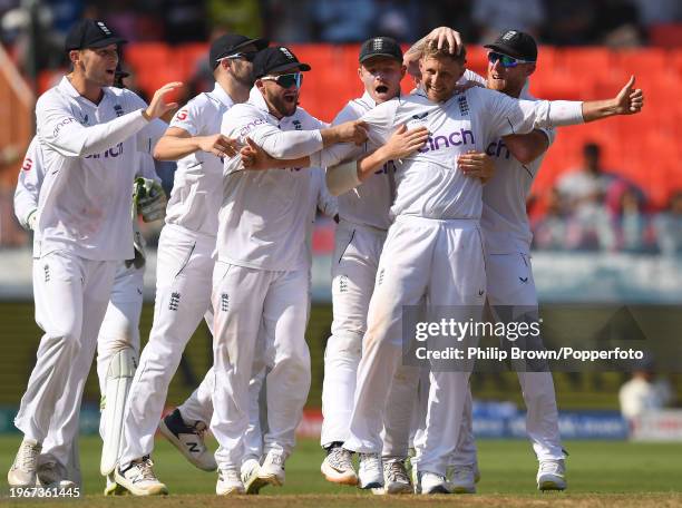 Joe Root celebrates with team-mates including Tom Hartley , Ben Duckett, Ollie Pope and Ben Stokes after dismissing KL Rahul during day four of the...