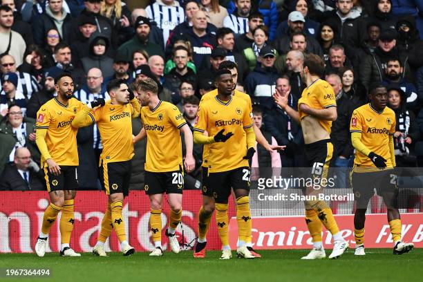 Pedro Neto of Wolverhampton Wanderers celebrates scoring his team's first goal with teammates during the Emirates FA Cup Fourth Round match between...
