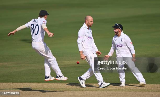 England bowler Jack Leach celebrates with team mates after taking the wicket of Shreyas Iyer during day four of the 1st Test Match between India and...