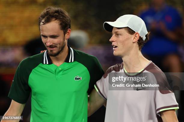 Daniil Medvedev and Jannik Sinner of Italy embrace at the net after their Men's Singles Final match during the 2024 Australian Open at Melbourne Park...