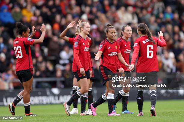 Nikita Parris of Manchester United celebrates scoring her team's second goal with teammates during the Barclays Women's Super League match between...
