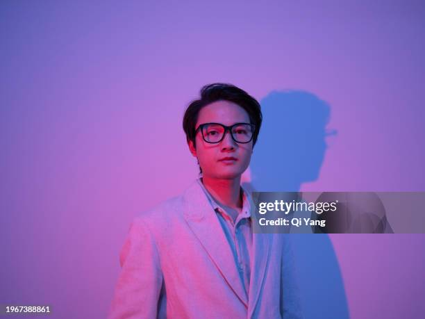 portrait of confident handsome asian businessman - pride gradient stock pictures, royalty-free photos & images