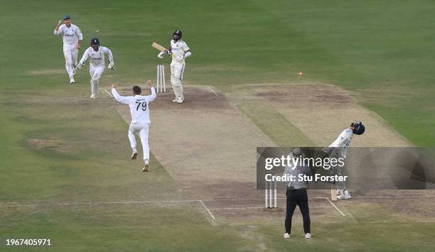 England wicketkeeper Ben Foakes celebrates with Tom Hartley after taking the final wicket of Mohammed Siraj as Jasprit Bumrah reacts at the non...