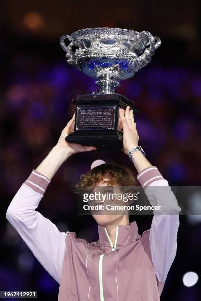 Jannik Sinner of Italy poses with the Norman Brookes Challenge Cup during the official presentation after their Men's Singles Final match against...
