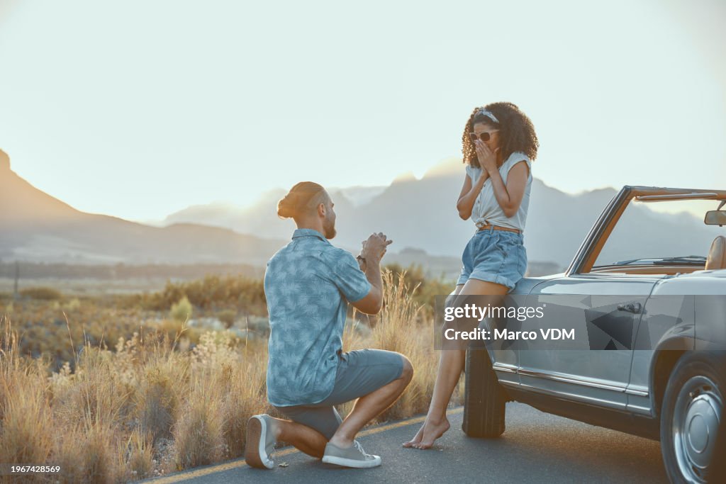 Love, propose or couple on outdoor road trip on holiday together with ring, surprise or care. Asking, wow or people in countryside with shock or one knee on vacation for romance and valentines day