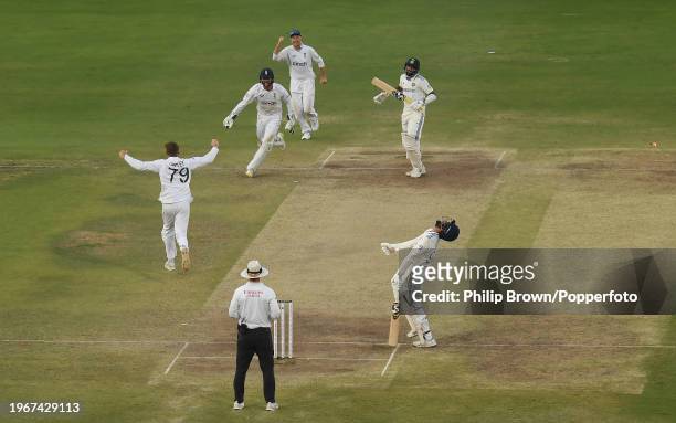 Jasprit Bumrah of India reacts as Tom Hartley, Ben Foakes and Joe Root celebrate after Mohammed Siraj was stumped as England won the 1st Test Match...
