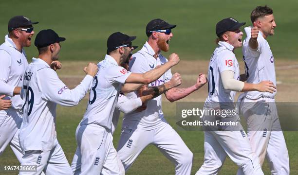 England bowler Joe Root celebrates with team mates after taking the wicket of KL Rahul after a review during day four of the 1st Test Match between...