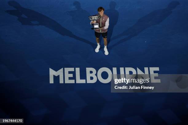 Jannik Sinner of Italy poses with the Norman Brookes Challenge Cup during the official presentation after their Men's Singles Final match against...