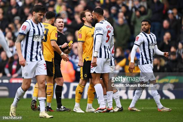 Craig Dawson of Wolverhampton Wanderers and Kyle Bartley of West Bromwich Albion clash during the Emirates FA Cup Fourth Round match between West...