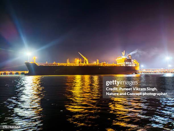 very large crude carrier ( vlcc ) berthed at an indian port in gujarat, india. - singh stock pictures, royalty-free photos & images