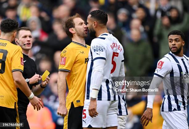 Craig Dawson of Wolverhampton Wanderers clashes with Kyle Bartley of West Bromwich Albion during the Emirates FA Cup Fourth Round match between West...