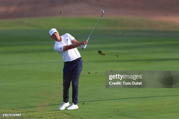 Rasmus Hojgaard of Denmark plays onto the 18th green during Day Four of the Ras Al Khaimah Championship at Al Hamra Golf Club on January 28, 2024 in...