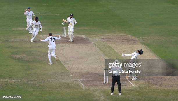 England wicketkeeper Ben Foakes celebrates with Tom Hartley after taking the final wicket of Mohammed Siraj as Jasprit Bumrah reacts at the non...