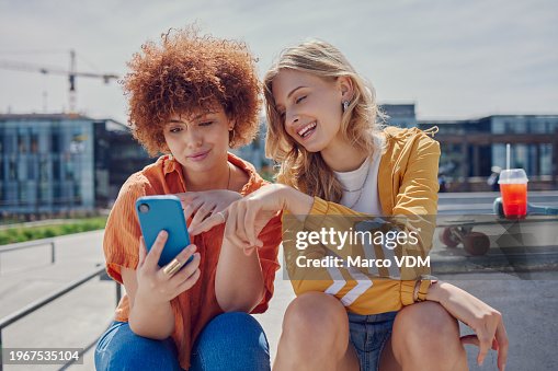 Skater women friends, phone and park with reading, point and meme with discussion for online gossip. Girl, gen z people and smartphone for chat, memory and funny video on social network app in city Skater women friends, phone and park with reading, point and meme with discussion for online gossip. Girl, gen z people and smartphone for chat, memory and funny video on social network app in city