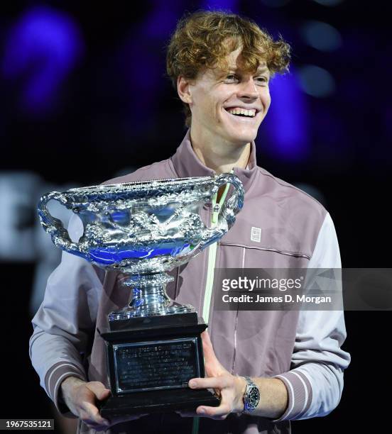 Jannik Sinner of Italy poses with the Norman Brookes Challenge Cup during the official presentation after his Men's Singles Final match against...