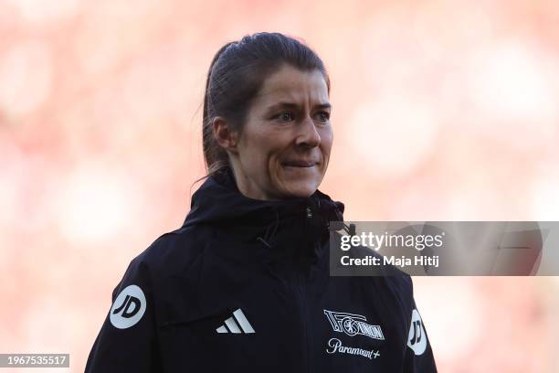 Marie-Louise Eta, Interim Head Coach of 1.FC Union Berlin, looks on during the warm up prior to the Bundesliga match between 1. FC Union Berlin and...